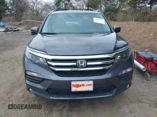2017 Honda Pilot Touring with VIN 5FNYF6H92HB012090, listed as a IAAI auction lot 41882542 with 110,179 mi miles and . Bid and sale history available at DreamBid. Image 12.