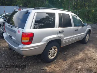 2002 Jeep Grand Cherokee Laredo z VIN 1J4GW48S62C261154, wystawiony jako IAAI lot #42602424 z przebiegiem 160 295 mil mil oraz . Historia ofert i sprzedaży dostępna na DreamBid. Obrazek 4.