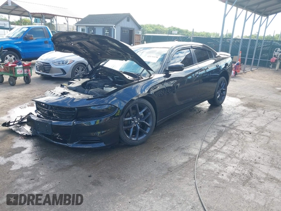 2023 Dodge Charger SXT z VIN 2C3CDXBG6PH598948, wystawiony jako IAAI lot #42171370 z przebiegiem 22 914 mil mil oraz . Historia ofert i sprzedaży dostępna na DreamBid. Obrazek 19.