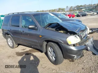 2004 Mazda Tribute LX with VIN 4F2CZ941X4KM19302, listed as a IAAI auction lot 41791389 with 123,036 mi miles. Bid and sale history available at carsss.com. Image 1.