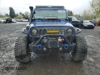 2009 Jeep Wrangler X with VIN 1J4FA24179L700884, listed as a Copart auction lot 52194055 with 96,189 mi miles and Salvage Title. Bid and sale history available at DreamBid. Image 5.