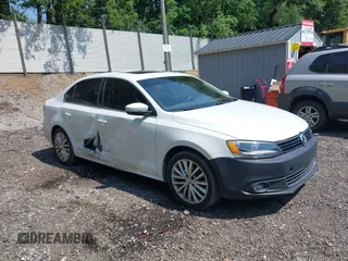 2014 Volkswagen Jetta TDI w/Premium with VIN 3VW3L7AJ3EM437691, listed as a IAAI auction lot 42483943 with 126,921 mi miles and . Bid and sale history available at DreamBid. Image 1.