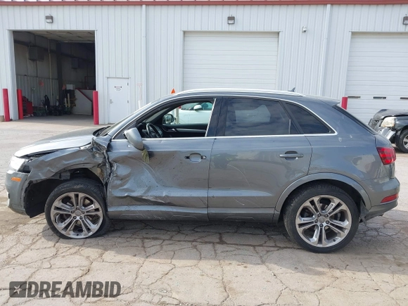 2015 Audi Q3 Prestige with VIN WA1GFCFS9FR007776, listed as a IAAI auction lot 42126928 with 110,981 mi miles and . Bid and sale history available at DreamBid. Image 14.