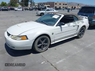2004 Ford Mustang Deluxe z VIN 1FAFP44684F179912, wystawiony jako IAAI lot #42359560 z przebiegiem 268 207 mil mil oraz . Historia ofert i sprzedaży dostępna na DreamBid. Obrazek 2.
