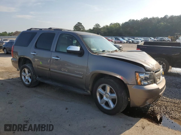 2011 Chevrolet Tahoe LS with VIN 1GNSCAE00BR395849, listed as a Copart auction lot 54750685 with 183,336 mi miles and Salvage title. Bid and sale history available at DreamBid. Image 4.