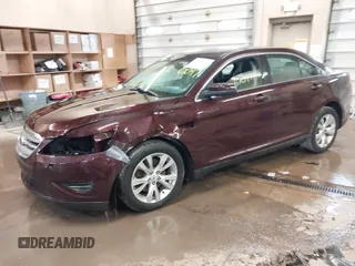 2011 Ford Taurus SEL z VIN 1FAHP2HW5BG141570, wystawiony jako IAAI lot #41867097 z przebiegiem 172 984 mil mil oraz . Historia ofert i sprzedaży dostępna na DreamBid. Obrazek 2.