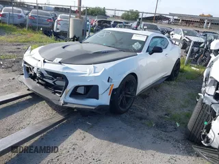 2018 Chevrolet Camaro ZL1 with VIN 1G1FJ1R61J0183374, listed as a IAAI auction lot 41622572 with 38,661 mi miles and . Bid and sale history available at DreamBid. Image 2.