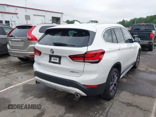 2021 BMW X1 xDrive28i with VIN WBXJG9C01M5S06181, listed as a IAAI auction lot 42292167 with 55,966 mi miles and . Bid and sale history available at DreamBid. Image 4.