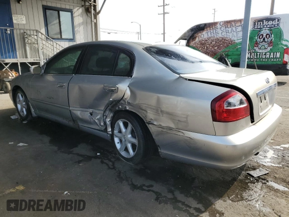 2003 Infiniti Q45 z VIN JNKBF01A03M101890, wystawiony jako Copart lot #86930994 z przebiegiem 158 134 mil mil oraz Szkody całkowita. Historia ofert i sprzedaży dostępna na DreamBid. Obrazek 2.
