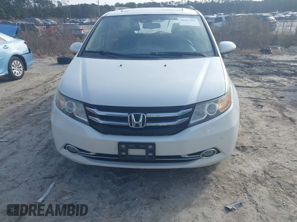 2014 Honda Odyssey Touring with VIN 5FNRL5H97EB127836, listed as a IAAI auction lot 41497413 with 174,914 mi miles and . Bid and sale history available at DreamBid. Image 12.