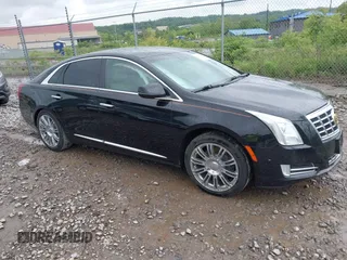 2014 Cadillac XTS Luxury z VIN 2G61M5S32E9231544, wystawiony jako IAAI lot #42340088 z przebiegiem 74 518 mil mil oraz . Historia ofert i sprzedaży dostępna na DreamBid. Obrazek 1.