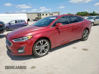 2019 Ford Fusion Titanium z VIN 3FA6P0D99KR153242, wystawiony jako Copart lot #66748105 z przebiegiem 51 331 mil mil oraz Czysty tytuł • Clean title. Historia ofert i sprzedaży dostępna na DreamBid. Obrazek 1.