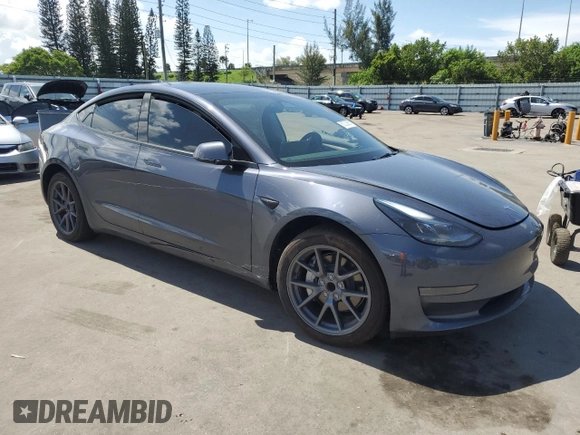 2023 Tesla Model 3 with VIN 5YJ3E1EA8PF704349, listed as a Copart auction lot 60220665 with 18,873 mi miles and Non repairable. Bid and sale history available at DreamBid. Image 4.