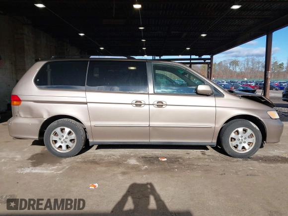 2004 Honda Odyssey EX-RES z VIN 5FNRL18874B127785, wystawiony jako IAAI lot #41141221 z przebiegiem 151 036 mil mil oraz . Historia ofert i sprzedaży dostępna na DreamBid. Obrazek 13.