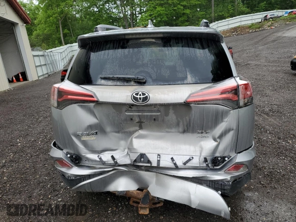 2018 Toyota RAV4 XLE with VIN JTMRFREV2JJ200677, listed as a Copart auction lot 59660535 with 82,283 mi miles and Salvage title. Bid and sale history available at DreamBid. Image 6.