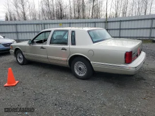 1997 Lincoln Town Car Executive with VIN 1LNLM81W9VY643745, listed as a Copart auction lot 47921365 with 68,821 mi miles and Salvage Title. Bid and sale history available at carsss.com. Image 2.