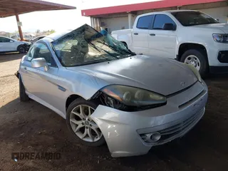 2008 Hyundai Tiburon GT z VIN KMHHN66F88U289387, wystawiony jako IAAI lot #42000030 z przebiegiem Nie podano mil oraz . Historia ofert i sprzedaży dostępna na DreamBid. Obrazek 1.