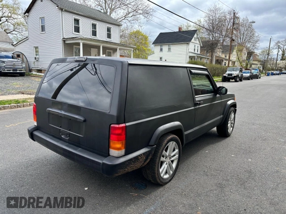 1997 Jeep Cherokee with VIN 1J4FT67S6VL571732, listed as a Copart auction lot 61440245 with 153,147 mi miles and Clean title. Bid and sale history available at DreamBid. Image 4.
