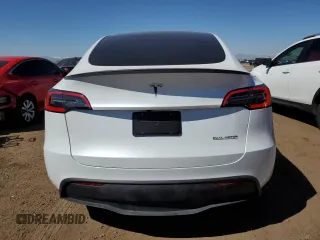 2024 Tesla Model Y Performance with VIN 7SAYGDEF6RA284171, listed as a Copart auction lot 50317205 with 6,870 mi miles and Salvage Title. Bid and sale history available at DreamBid. Image 6.