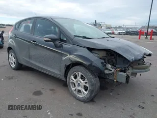 2015 Ford Fiesta SE z VIN 3FADP4EJ1FM205246, wystawiony jako IAAI lot #41432138 z przebiegiem 103 517 mil mil oraz . Historia ofert i sprzedaży dostępna na DreamBid. Obrazek 1.