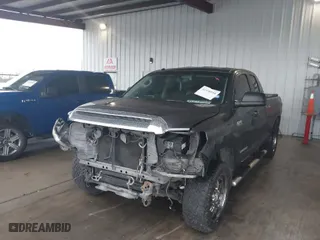 2014 Toyota Tundra 2WD Truck SR with VIN 5TFRY5F15EX166929, listed as a IAAI auction lot 41458810 with 142,152 mi miles. Bid and sale history available at carsss.com. Image 6.