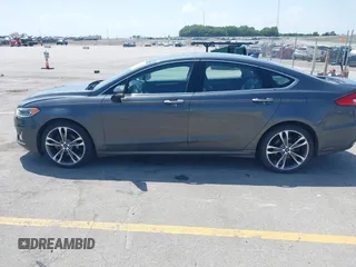 2020 Ford Fusion Titanium with VIN 3FA6P0D9XLR131042, listed as a IAAI auction lot 42560444 with 95,351 mi miles and . Bid and sale history available at DreamBid. Image 14.
