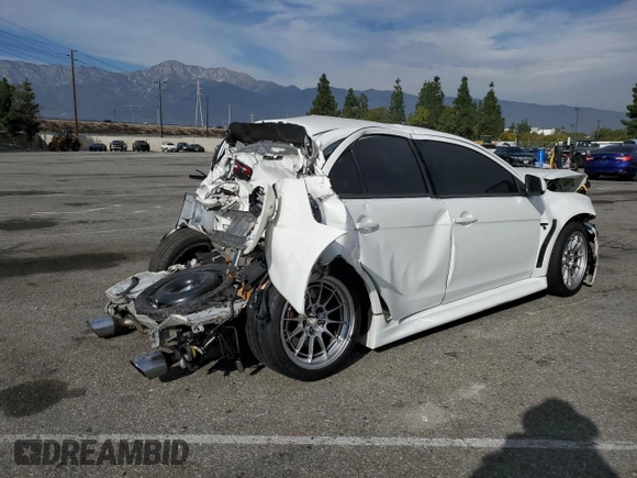 2014 Mitsubishi Lancer Evolution GSR z VIN JA32W8FV2EU019253, wystawiony jako Copart lot #86615084 z przebiegiem 104 894 mil mil oraz Szkody całkowita. Historia ofert i sprzedaży dostępna na DreamBid. Obrazek 3.