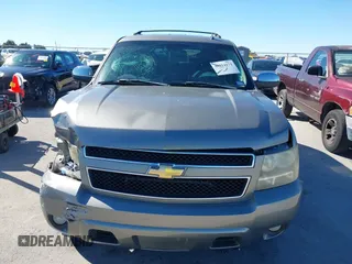 2007 Chevrolet Tahoe LTZ with VIN 1GNFC13J97R155705, listed as a IAAI auction lot 40914171 with 165,727 mi miles and . Bid and sale history available at DreamBid. Image 6.