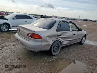 1999 Toyota Corolla VE z VIN 1NXBR12E0XZ215258, wystawiony jako Copart lot #60704095 z przebiegiem Nie podano mil oraz Szkoda całkowita • Salvage title. Historia ofert i sprzedaży dostępna na DreamBid. Obrazek 3.