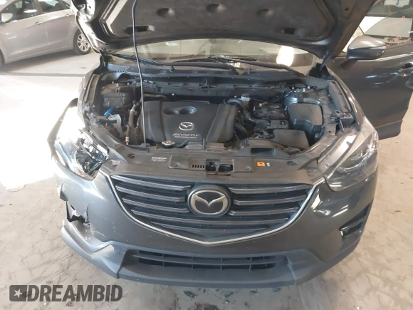 2016 Mazda CX-5 Grand Touring with VIN JM3KE2DYXG0846787, listed as a IAAI auction lot 41346364 with 113,553 mi miles. Bid and sale history available at carsss.com. Image 10.