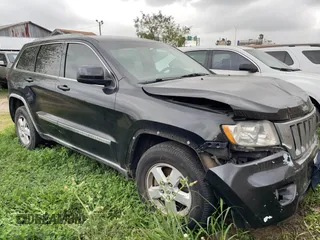 2012 Jeep Grand Cherokee Laredo with VIN 1C4RJEAG8CC119401, listed as a IAAI auction lot 41724335 with 233,265 mi miles. Bid and sale history available at carsss.com. Image 1.