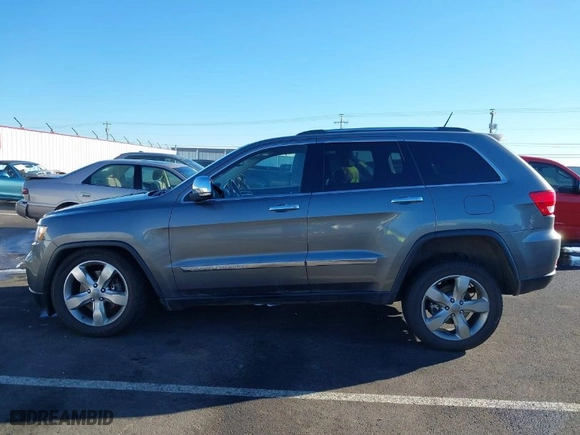 2013 Jeep Grand Cherokee Overland Summit with VIN 1C4RJFCT7DC585841, listed as a IAAI auction lot 41401170 with 122,719 mi miles. Bid and sale history available at carsss.com. Image 14.