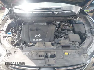 2016 Mazda CX-5 Sport z VIN JM3KE2BY0G0633611, wystawiony jako IAAI lot #42390654 z przebiegiem Nie podano mil oraz . Historia ofert i sprzedaży dostępna na DreamBid. Obrazek 10.
