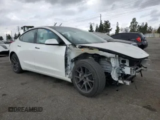 2021 Tesla Model 3 Standard Range Plus with VIN 5YJ3E1EA6MF066064, listed as a Copart auction lot 54063625 with 27,424 mi miles and Salvage Title. Bid and sale history available at DreamBid. Image 4.