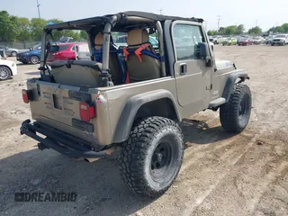 2005 Jeep Wrangler SE with VIN 1J4FA29S25P328827, listed as a IAAI auction lot 41917807 with 157,562 mi miles. Bid and sale history available at carsss.com. Image 4.