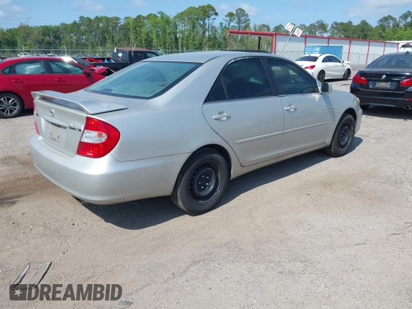 2003 Toyota Camry LE with VIN 4T1BE32K63U752904, listed as a IAAI auction lot 42142677 with 112,895 mi miles and . Bid and sale history available at DreamBid. Image 4.