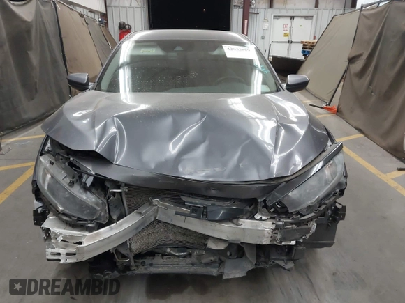 2020 Honda Civic LX with VIN 19XFC2F67LE006057, listed as a IAAI auction lot 42032759 with 119,319 mi miles and . Bid and sale history available at DreamBid. Image 13.