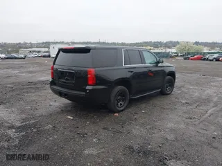 2015 Chevrolet Tahoe Commercial with VIN 1GNSK2EC8FR570602, listed as a IAAI auction lot 41977021 with 115,866 mi miles. Bid and sale history available at carsss.com. Image 4.