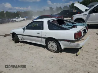 1986 Toyota Supra z VIN JT2MA70L7G0014661, wystawiony jako Copart lot #72161554 z przebiegiem 160 516 mil mil oraz Czysty tytuł • Clean title. Historia ofert i sprzedaży dostępna na DreamBid. Obrazek 2.