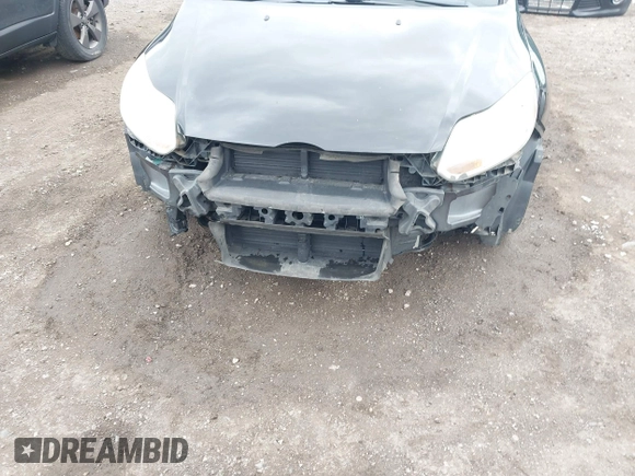 2012 Ford Focus SE with VIN 1FAHP3F27CL112277, listed as a IAAI auction lot 42053243 with 104,885 mi miles. Bid and sale history available at carsss.com. Image 6.
