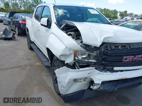 2019 GMC Canyon 4WD SLE z VIN 1GTG6CENXK1319647, wystawiony jako IAAI lot #42039568 z przebiegiem 56 371 mil mil oraz . Historia ofert i sprzedaży dostępna na DreamBid. Obrazek 6.