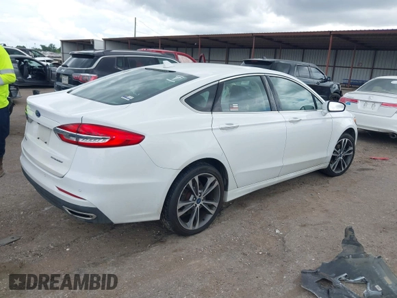 2020 Ford Fusion Titanium с VIN 3FA6P0D98LR151810, выставлен на аукционе IAAI как лот 42590902 с пробегом 76 624 миль миль и . История ставок и продаж доступна на DreamBid. Изображение 4.