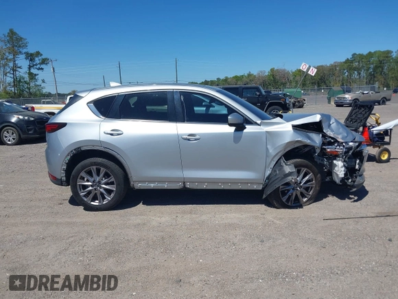 2019 Mazda CX-5 Grand Touring with VIN JM3KFADM1K1606082, listed as a IAAI auction lot 41875878 with 66,089 mi miles. Bid and sale history available at carsss.com. Image 13.