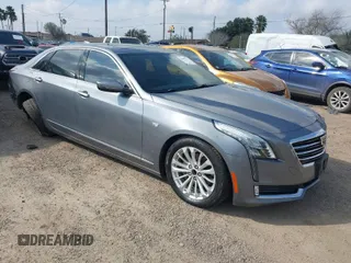 2018 Cadillac CT6 Luxury RWD z VIN 1G6KC5RX7JU159785, wystawiony jako IAAI lot #41521571 z przebiegiem 80 701 mil mil oraz . Historia ofert i sprzedaży dostępna na DreamBid. Obrazek 1.