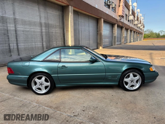 2002 Mercedes-Benz SL 500 with VIN WDBFA68F42F204673, listed as a Copart auction lot 56757525 with 32,967 mi miles and Clean title. Bid and sale history available at DreamBid. Image 13.