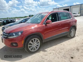 2014 Volkswagen Tiguan SE with VIN WVGAV3AX4EW097495, listed as a Copart auction lot 61488365 with 76,701 mi miles and Salvage title. Bid and sale history available at DreamBid. Image 1.
