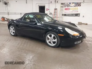 1999 Porsche Boxster z VIN WP0CA2984XU622814, wystawiony jako IAAI lot #42234977 z przebiegiem 52 404 mil mil oraz . Historia ofert i sprzedaży dostępna na DreamBid. Obrazek 1.