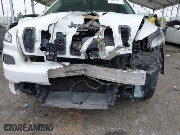 2015 Jeep Cherokee Latitude with VIN 1C4PJLCB5FW642701, listed as a IAAI auction lot 42063262 with 142,501 mi miles and . Bid and sale history available at carsss.com. Image 6.
