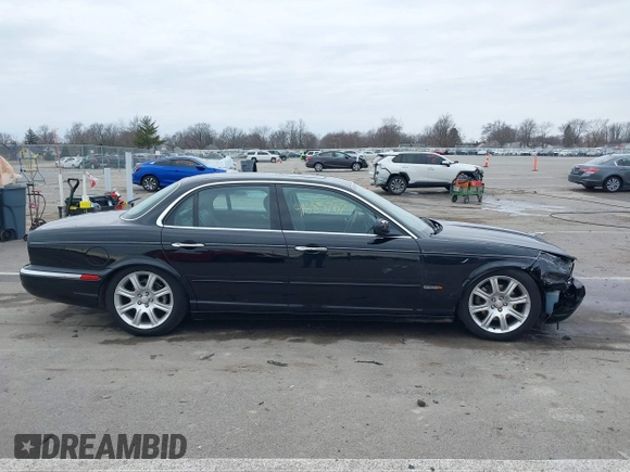 2004 Jaguar XJ with VIN SAJWA71C14SG20122, listed as a IAAI auction lot 41685767 with 113,392 mi miles. Bid and sale history available at carsss.com. Image 14.