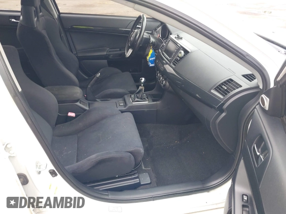 2013 Mitsubishi Lancer Evolution GSR z VIN JA32W8FV0DU023509, wystawiony jako IAAI lot #42222552 z przebiegiem 128 030 mil mil oraz . Historia ofert i sprzedaży dostępna na DreamBid. Obrazek 5.
